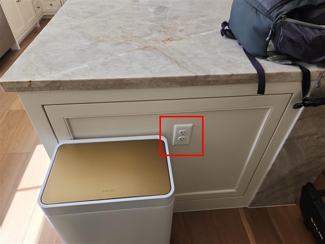 Kitchen island receptacle flagged in the inspection report