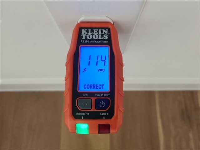 Outlet voltage tester reading 114 VAC