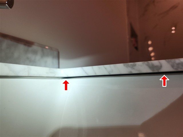 Pinched/clogged condensate drain line under a guest bath sink